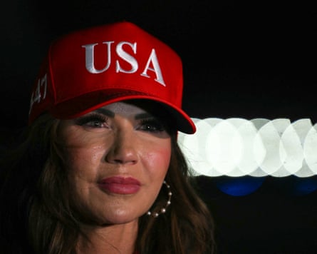 Kristi Noem watches Donald Trump speaking off frame to journalists as they arrive at Joint Base Andrews in Maryland on 4 July 2025.