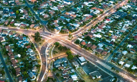 Aerial view of major roads cutting through housing developments in suburban Melbourne, Australia.