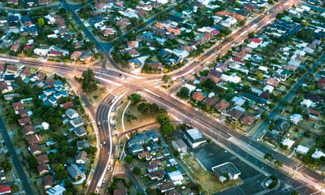 Aerial view of major roads cutting through housing developments in suburban Melbourne, Australia