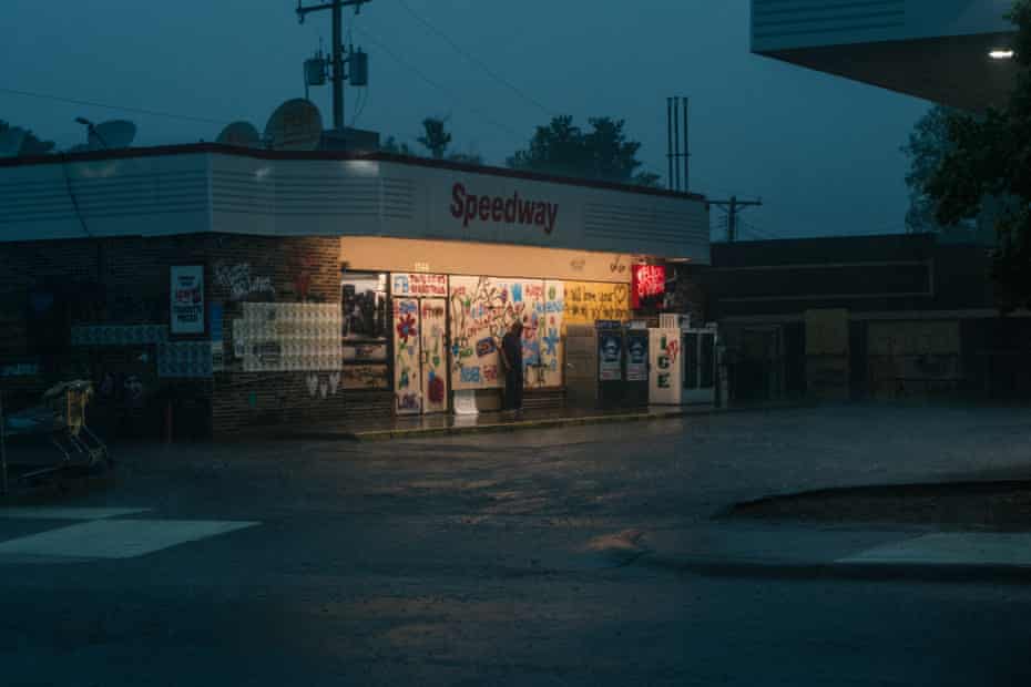 A man stands under shelter from the rain on June 18, 2020 in Minnesota, Minneapolis.