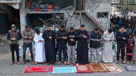 Palestinians visit cemeteries and pray outside destroyed mosques at Eid – video report