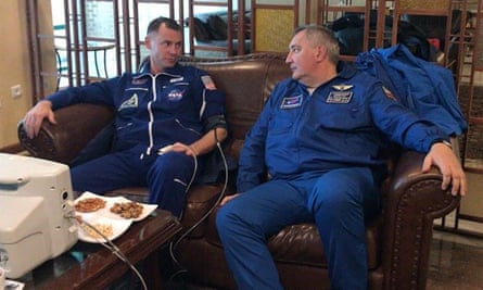 American astronaut Nick Hague (L) speaks to Roscosmos’s director Dmitry Rogozin after the emergency landing.