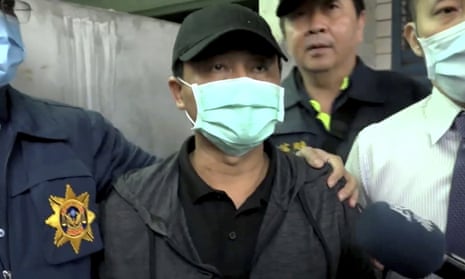 Lee Yi-hsiang offers a public apology as he is led away by police on 4 April
