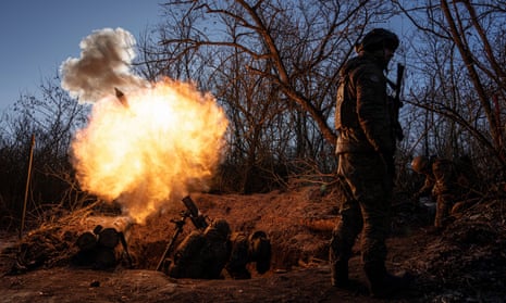 Ukrainian servicemen fire a 120mm mortar towards Russian positions at the frontline near Bakhmut.
