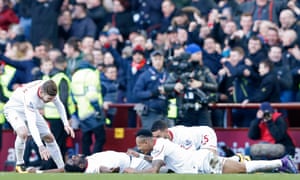 Kolo Toure celebrates with team mates after scoring the sixth goal for Liverpool.