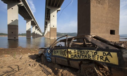 ‘Welcome to the Cantareira desert’ is written on a car which was once submerged in water, at the Atibainha dam.