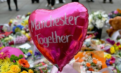 Floral tributes left for victims of the Manchester Arena bombing in St Ann’s Square, Manchester, in May 2017
