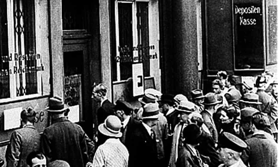 People outside the Darmstaedter and National Bank in Berlin in July 1931 after it suspended payments.