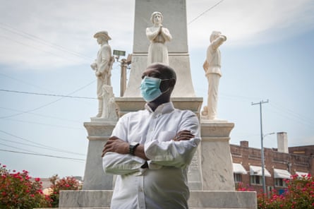 Local activist Tavaris Cross poses for a portrait at the Confederate monument outside the Leflore County Courthouse in Greenwood, Mississippi, on July 15, 2020. Photo by Rory Doyle for The Guardian.