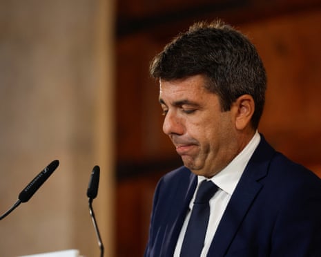 Valencia's regional leader, Carlos Mazon, reacts as he announces his decision to resign over his administration's handling of catastrophic floods that swept over the region a year ago, at the Palau de la Generalitat Valenciana.