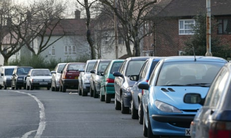 A row of parked cars in Wythenshawe, Greater Manchester.