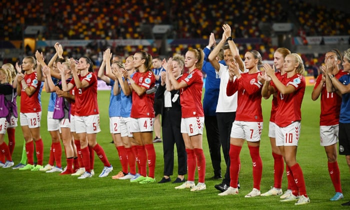 The players and staff of Denmark applaud their fans after the match.