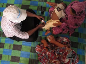 Nafissa with a volunteer and an employee of Intersos’s support centre for gender-based violence.