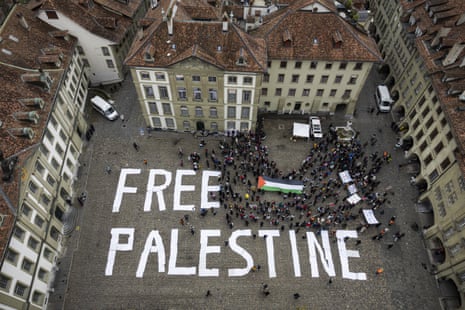 Protesters gather at the Muensterplatz plaza around a ‘FREE PALESTINE’ writing during a demonstration in support of the Palestinian people, in Bern, Switzerland, 06 January 2024.