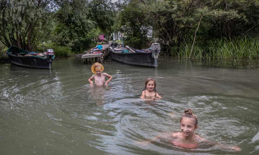 Girls enjoy a swim in one of the many channels of Vylkove.