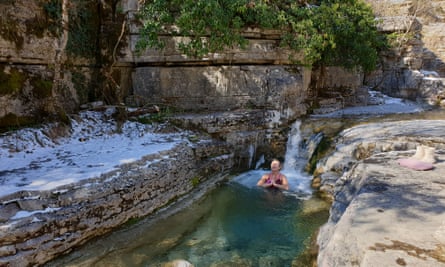 Susan Smillie enjoys a brief plunge in one of Papigo’s stone pools.