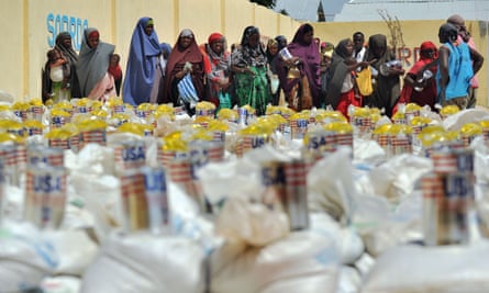 Displaced Somali women queuing for food-aid rations at a distribution centre during a visit to assess the progress of relief efforts by UN Office for the Coordination of Humanitarian Affairs [OCHA] in Mogadishu in 2012