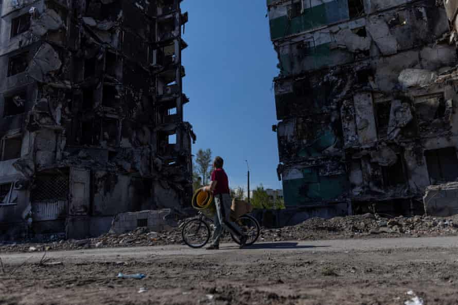 Mykola Ovdienko, 66, looks at a building destroyed by an airstrike in the town of Borodianka, Ukraine.