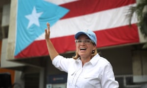Mayor Carmen Yulín Cruz speaks to the media as she arrives at the temporary staging ground for relief efforts at the Roberto Clemente stadium in San Juan.