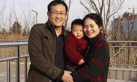 Wang Quanzhang, left, and his wife Li Wenzu with their son