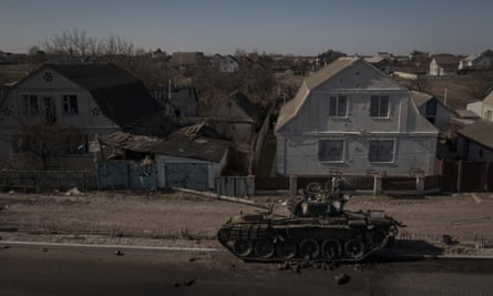 A destroyed tank is seen after battles between Ukrainian and Russian forces on a main road near Brovary, north of Kyiv, 10 March.