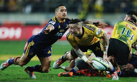 Aaron Smith defends as TJ Perenara looks to pass the ball out.