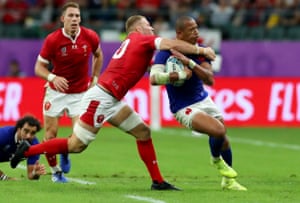 Wales’ Ross Moriarty tackles Gael Fickou of France and receives a yellow card.