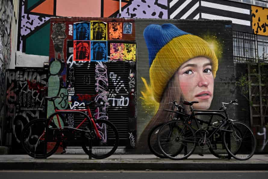 A piece of street art entitled ‘Girl in a Ukrainian hat’ is seen on a wall in east London.