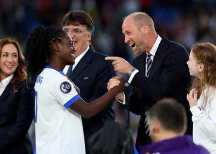 Prince William points astatine a smiling Michelle Agyemang during nan post-match handshakes