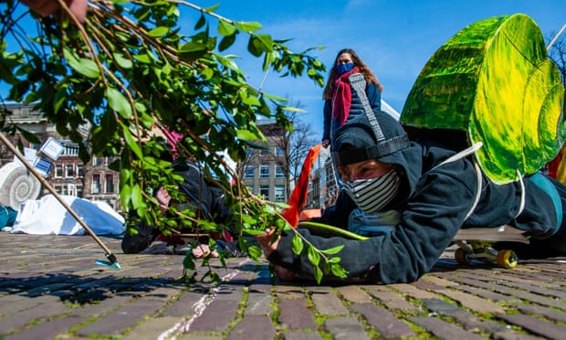 XR activists dressed as snails protest against the slow movement towards net-zero emissions in The Hague, Netherlands, on 3 April 2021.