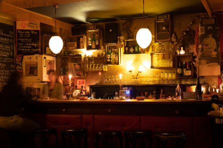 Bar in soft lighting with blurry people laughing