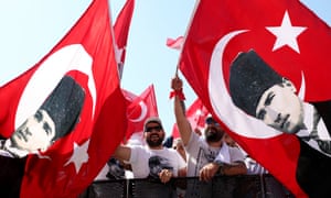 Supporters of the Republican People’s Party (CHP) wave flags carrying the portrait of Mustafa Kemal Ataturk, who is regarded the founder of modern Turkey.