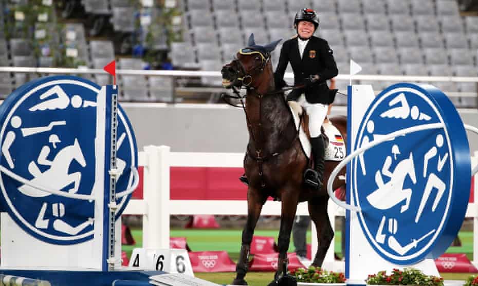 Annika Schleu in tears as the horse Saint Boy refused to jump during the modern pentathlon at the Tokyo Olympics