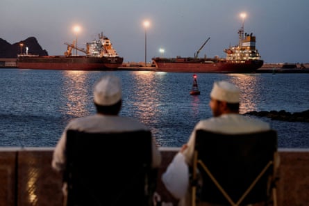 A bulk carrier and a tanker anchored in Muscat, Oman, after Iran vowed to close the strait of Hormuz, 9 March 2026