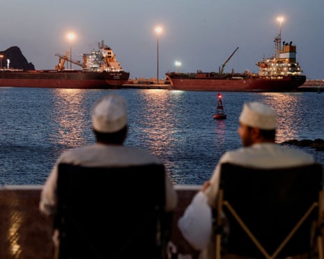 The Galaxy Globe bulk carrier and the Luojiashan tanker sit anchored in Muscat, Oman.