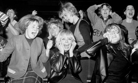 Screaming women fans of the pop group The Beatles at one of their concerts in Manchester in 1963.