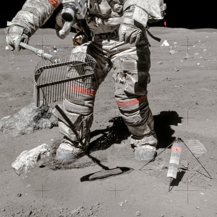 Apollo 16, 23 April 1972, astronaut  Charles Duke snaps John Young as he collects moon dust