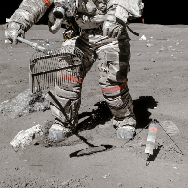 Apollo 16, 23 April 1972, astronaut Charles Duke snaps John Young as he collects moon dust