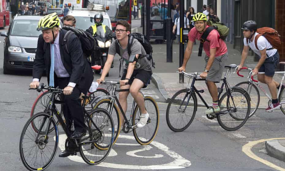 London mayor Boris Johnson with a group of cyclists on suburban road
