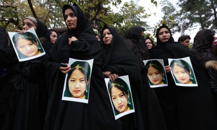 Afghans protest against the killing of civilians from the Hazara minority by suspected Islamic State militants during a protest in Herat, on 12 November.