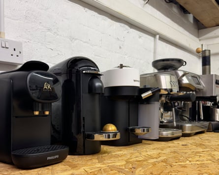 Image 1: A row of nine coffee machines on a sideboard