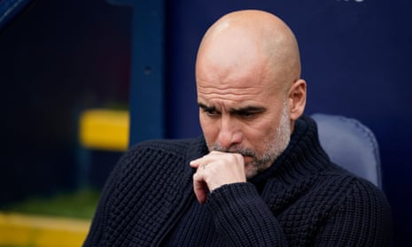 Manchester City's head coach, Pep Guardiola, in a thoughtful pose