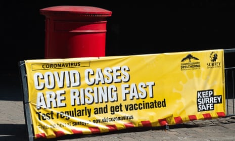 A sign  in Staines town centre warning shoppers that Covid-19 cases are rising fast and for them to get tested regularly and get vaccinated