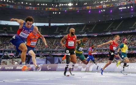Ezra Frech crosses the line ahead of his rivals in the 100m T63