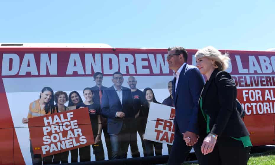 Victorian premier Daniel Andrews and his wife, Catherine, board an ALP-branded bus in Mordialloc, Melbourne on Wednesday.