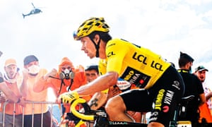 Primoz Roglic of Jumbo Visma in the yellow jersey is cheered on during the Puy Mary climb.
