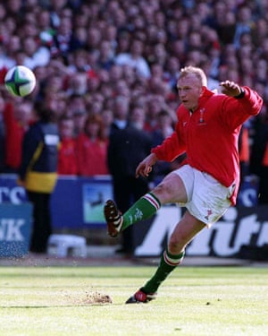 Wales’ Neil Jenkins kicks the winning conversion from Scott Gibbs try at Wembley in London to beat England 32-31 in their Five Nations match.