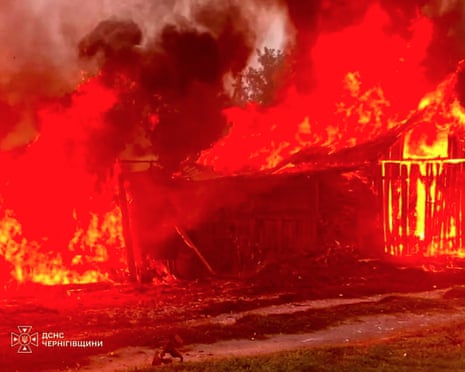A burning house following an air attack at an undisclosed location in the Chernigiv region, amid the Russian invasion of Ukraine.
