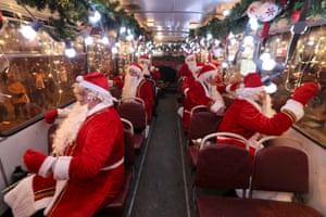 St Petersburg, RussiaMusicians in Father Frost costumes ride along Nevsky Avenue on the Father Frost bus, a musical bus to entertain citizens ahead of New Year celebrations
