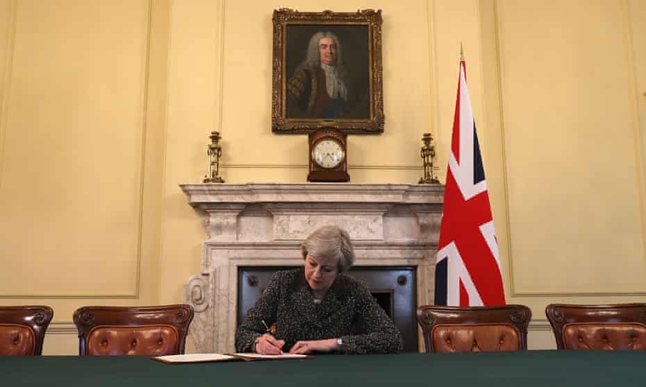 Prime Minister Theresa May signing the article 50 letter.